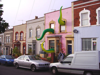 Illustration for article titled Giant Green Tentacles Attack Buildings from the Inside